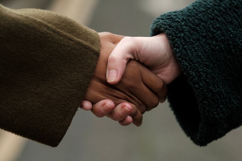 Two businesspeople shaking hands, showing mutual respect and successful negotiation, creating a powerful image of collaboration and partnership